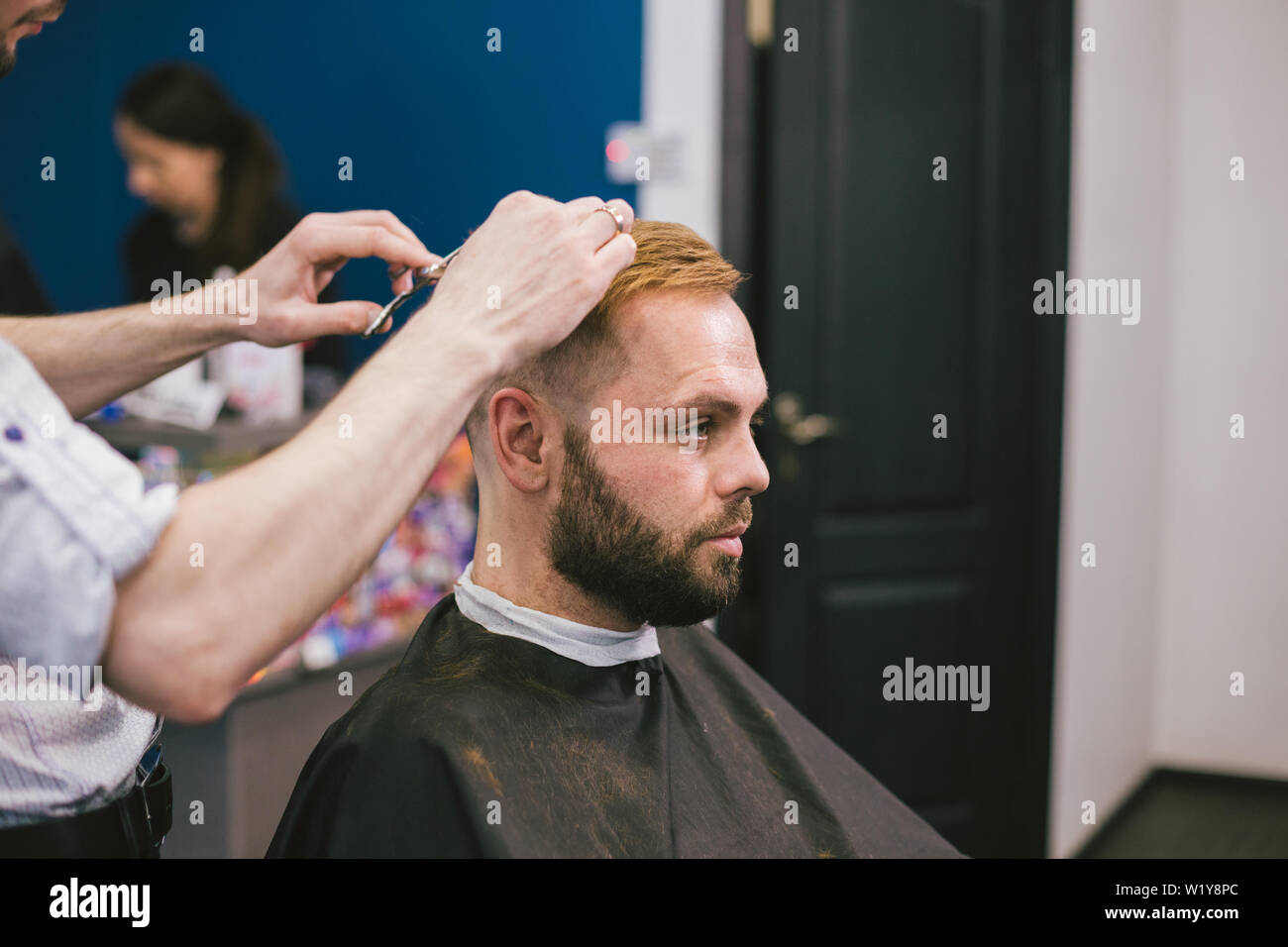 Barber Making Haircut Bearded Man In Barbershop