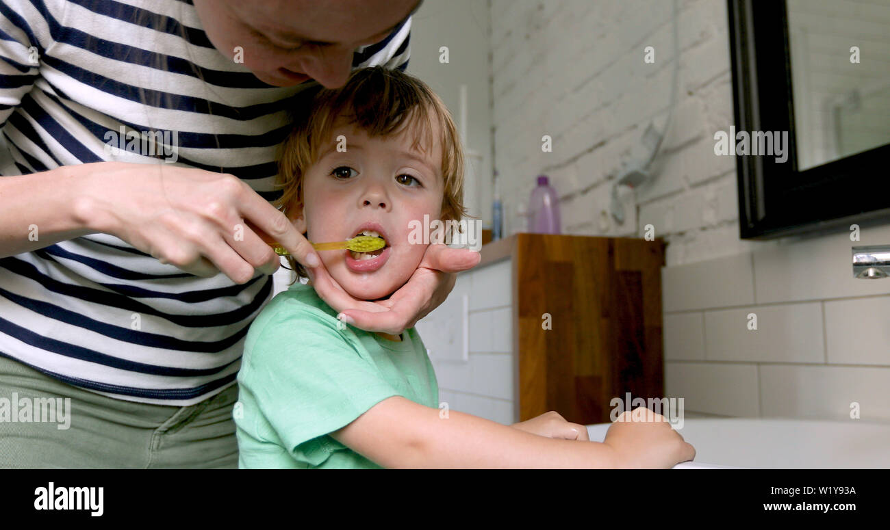 Mother teaching son brush his teeth Stock Photo