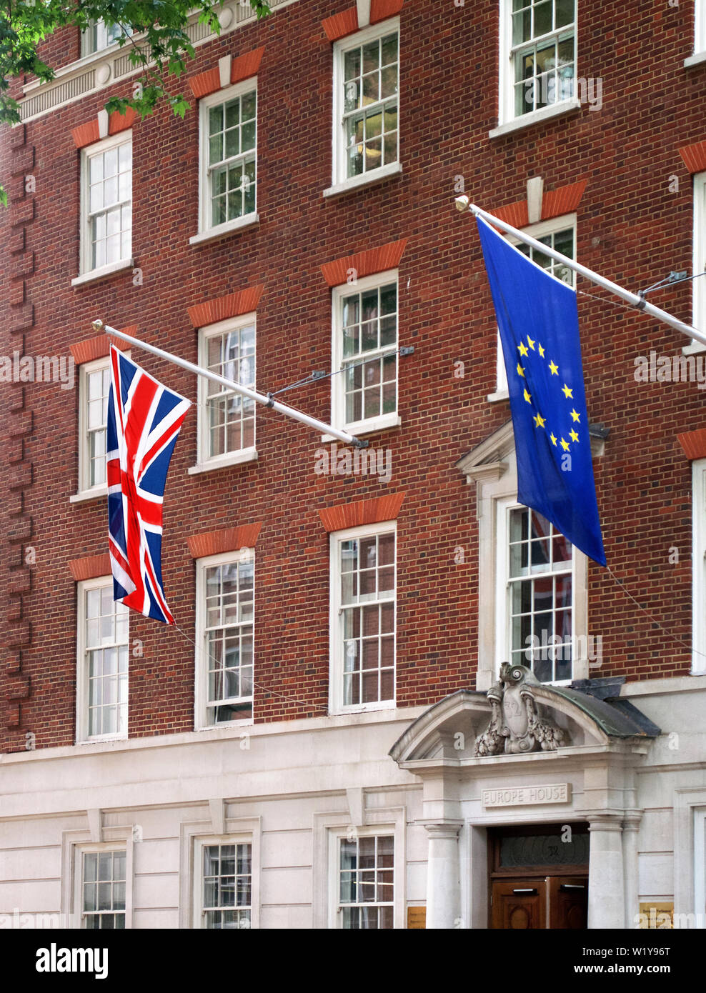 The flags of Great Britain and the European Union flying side by side in Smith Square, London Stock Photo