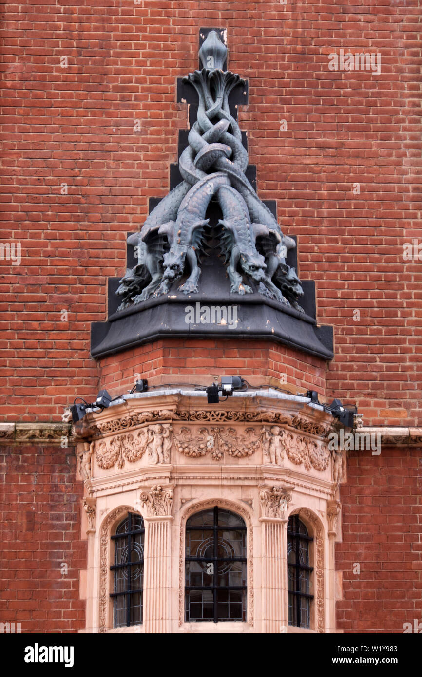 Sculpture of mythical multi-headed creature in Kensington Court, London Stock Photo