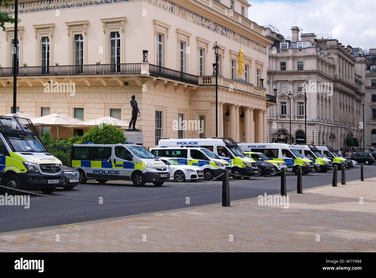 Police vehicles on stand-by in Waterloo Place, London Stock Photo
