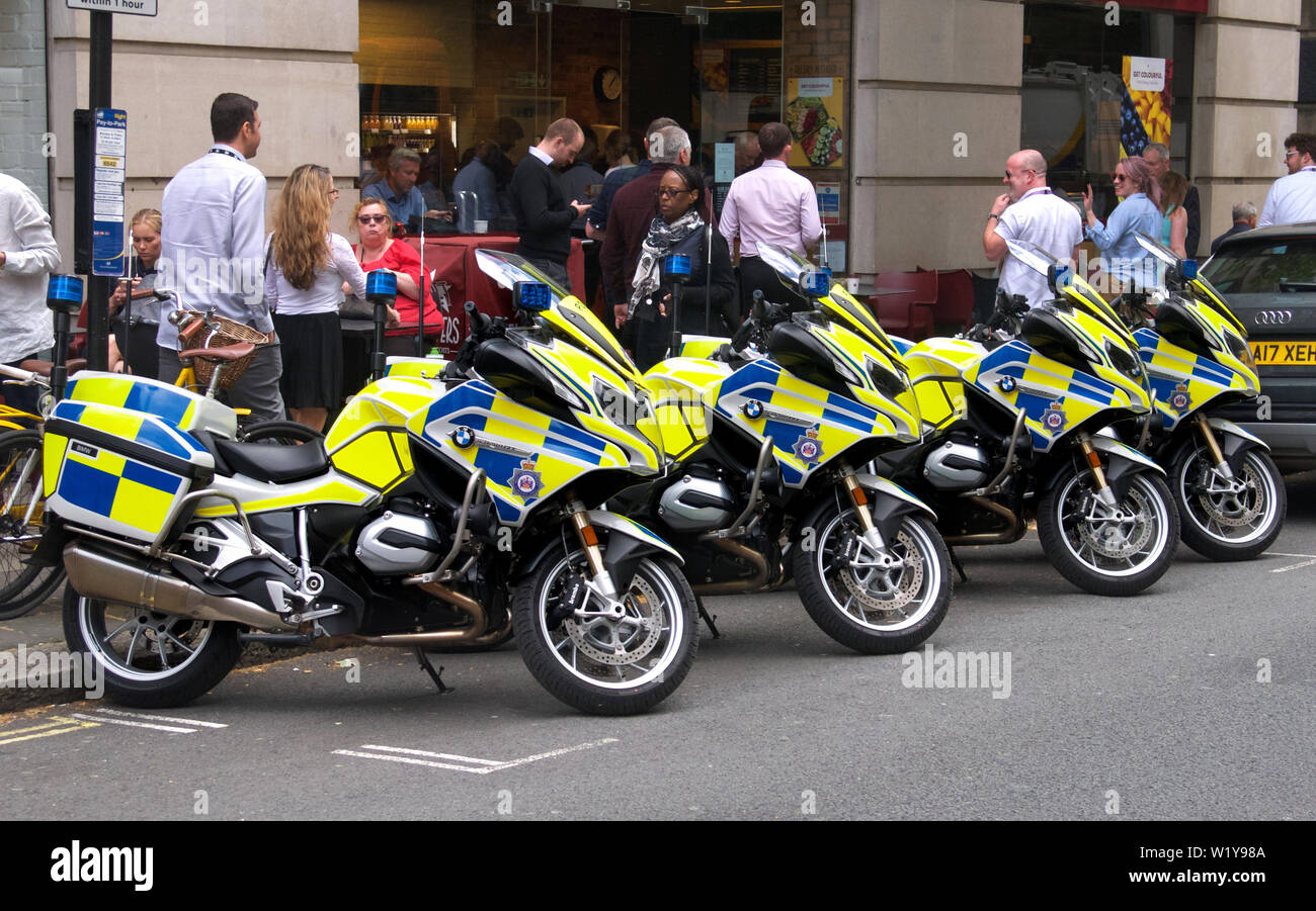 Four police motorbikes in a row, London Stock Photo