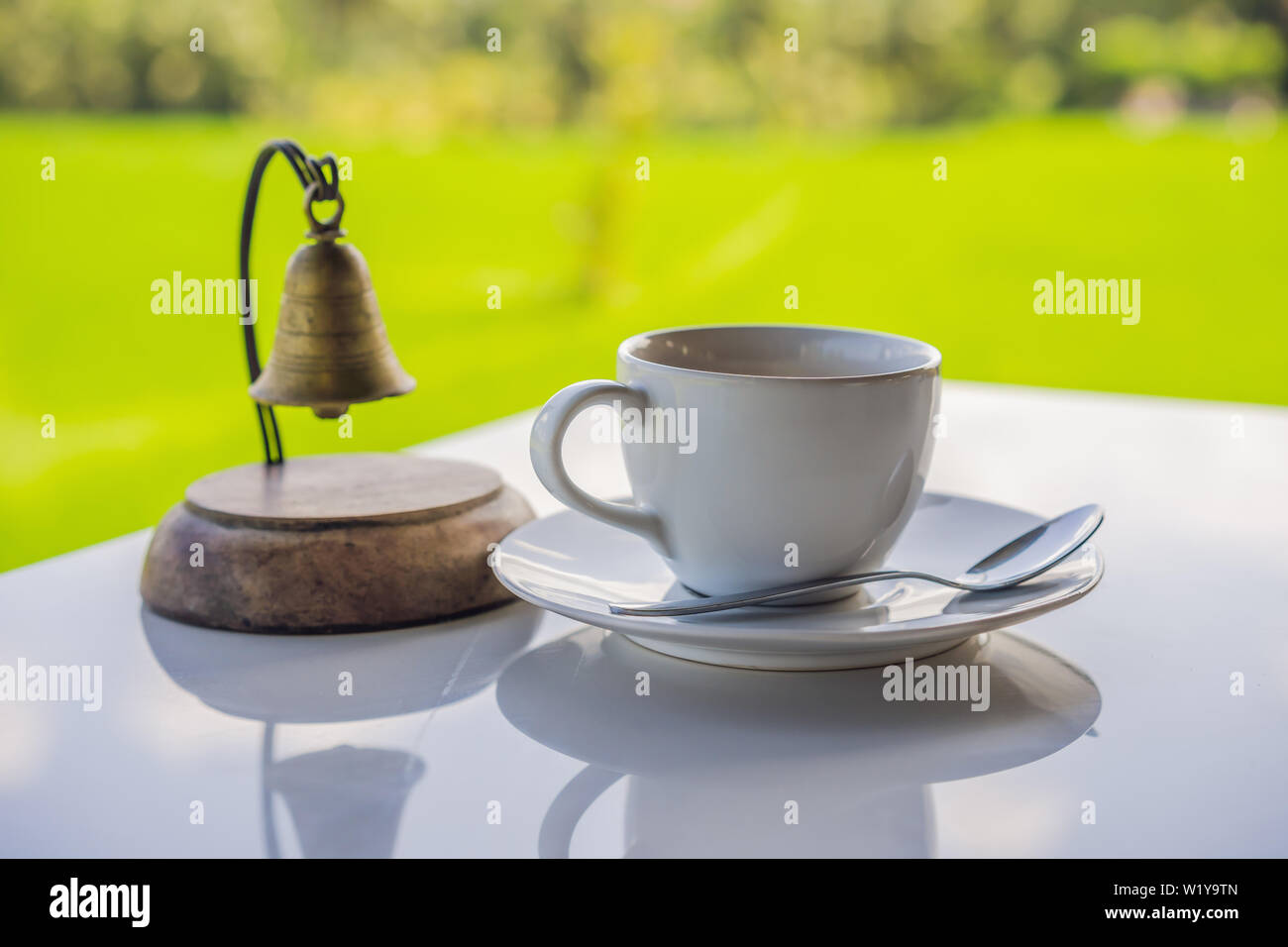 Cup of hot tea with sacking on the wooden table and the rice fields  background Stock Photo - Alamy