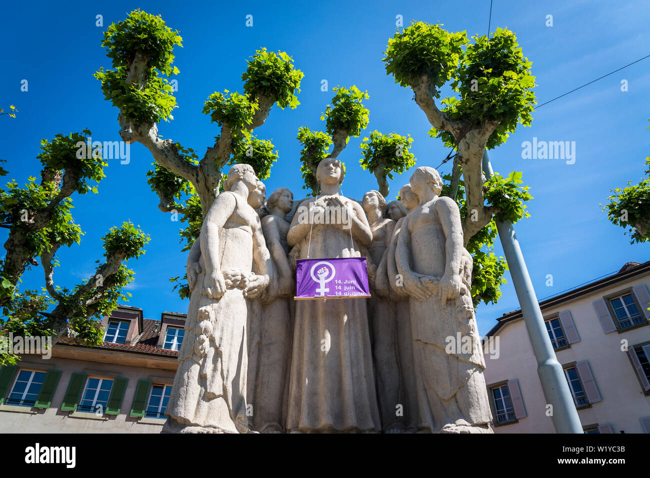 Monument comprising of female figures with an advertisement for Women's