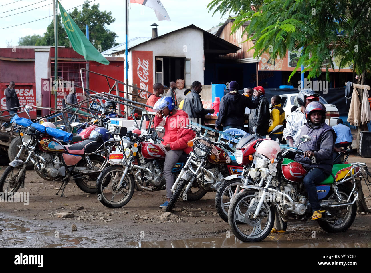 Motorcycle taxis wait for customers in the streets of Mbeya, Tanzania, Africa.    ---   Motorradtaxis warten auf Kundschaft in den Straßen von Mbeya, Tansania. Stock Photo