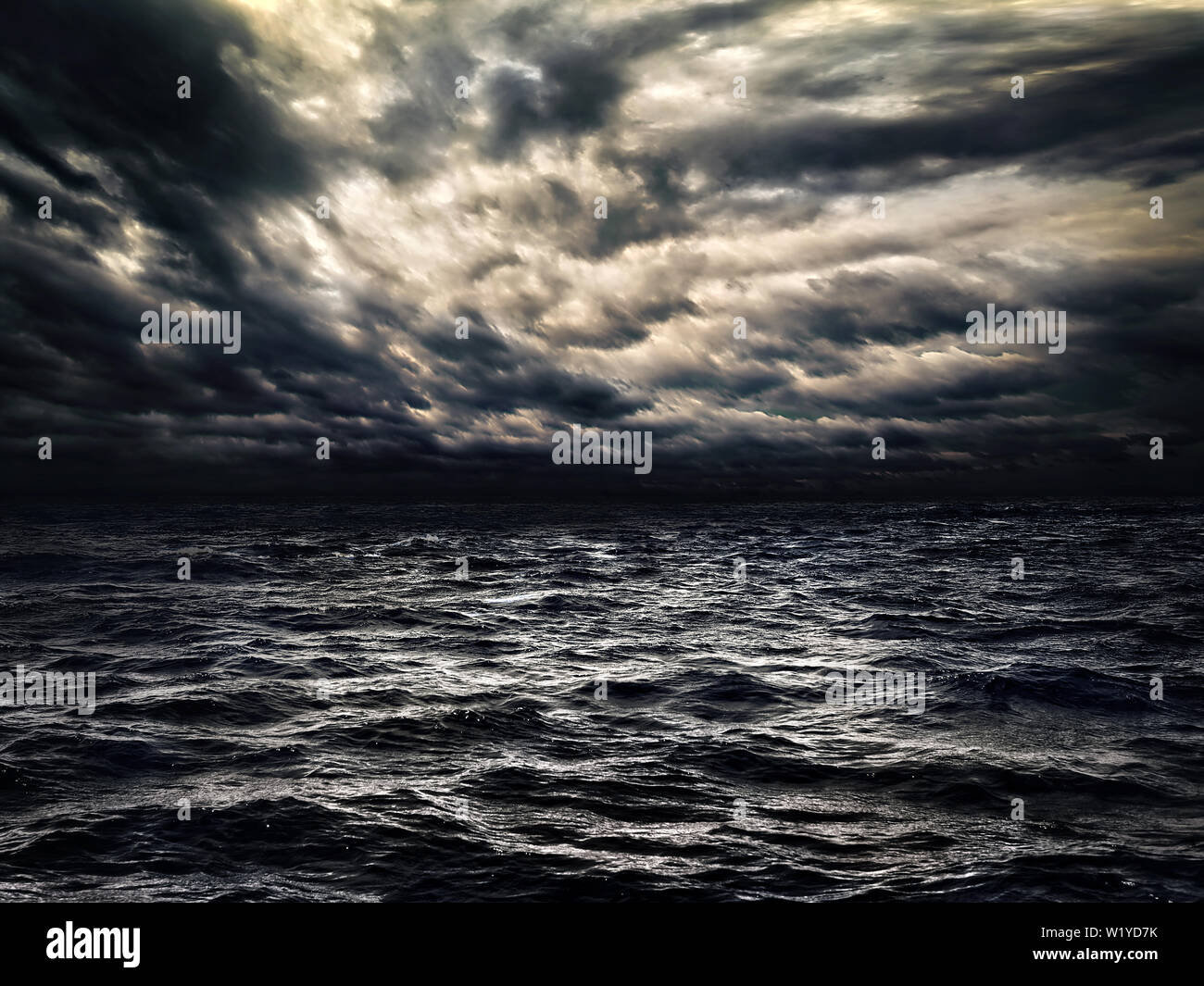 dark stormy sea with a dramatic cloudy sky Stock Photo - Alamy