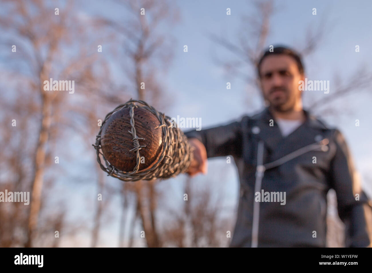man in leather jacket and baseball bat Stock Photo Alamy