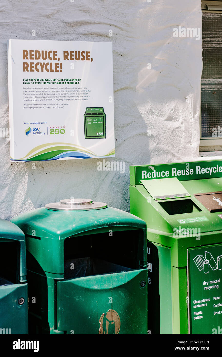 Reduce reuse recycle bins, recycling concept, green bins, climate change, environment, carbon footprint, reducing waste paper bins, compartments Stock Photo