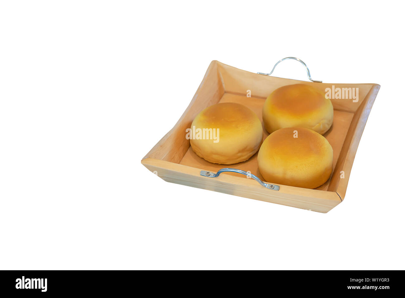 Isolated bread made from plastic in wood plate on a white background with clipping path. Stock Photo