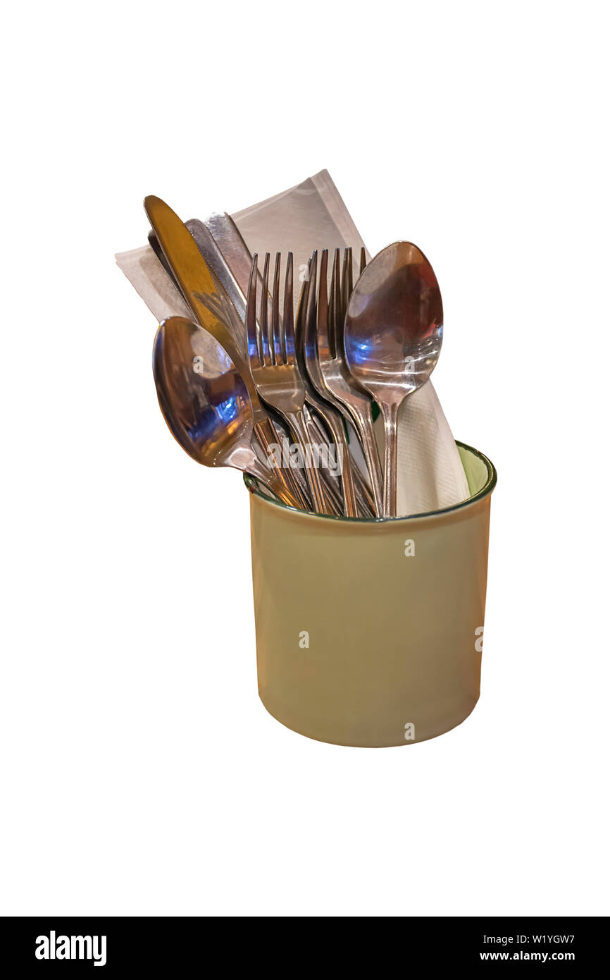 Isolated Spoon, fork and knife in a glass of zinc. on a white background with clipping path. Stock Photo