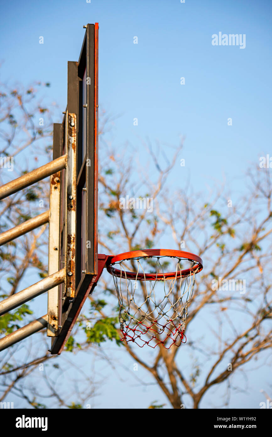 Basketball hoop background blurry tree and sky Stock Photo Alamy