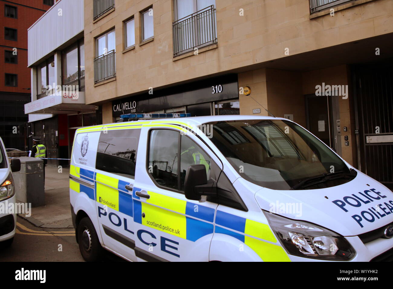 Glasgow, Scotland, UK 4th July, 2019.Euro Hostel River Suicide scuffle led to police cordoning off the hostel and the Clyde walkway by the South Portland Street Suspension Bridge and the la passionata Spanish civil war statue famous for its better to “die on your feet than live  forever on your knees” quote: Gerard Ferry/ Alamy Live News Stock Photo