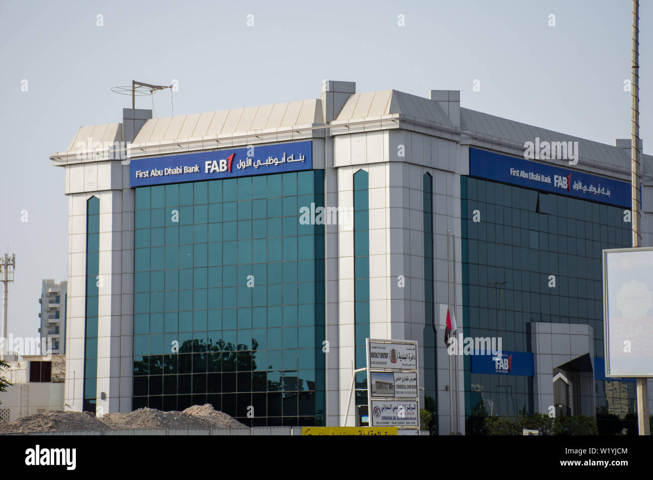 'Ras al Khaimah, Ras al Khaimah/United Arab Emirates - 7/4/2019: 'First Abu Dhabi (FAB) Bank blue storefront on a blue sky sunny day. ' Stock Photo