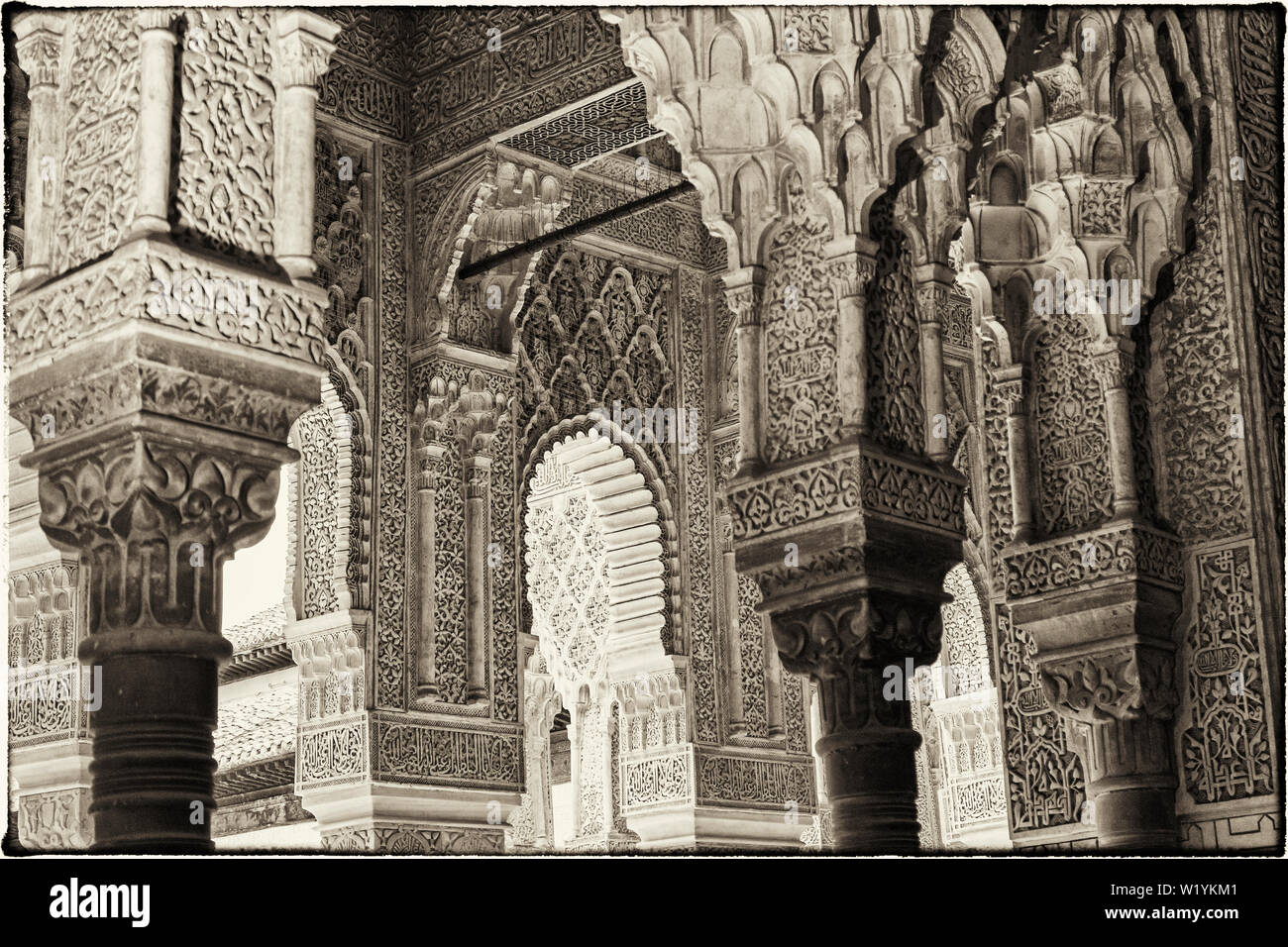 Decorated columns and arches in the Alhambra, Granada, Granada Province, Andalusia, southern Spain.  The Alhambra, Generalife and Albayzin are designa Stock Photo