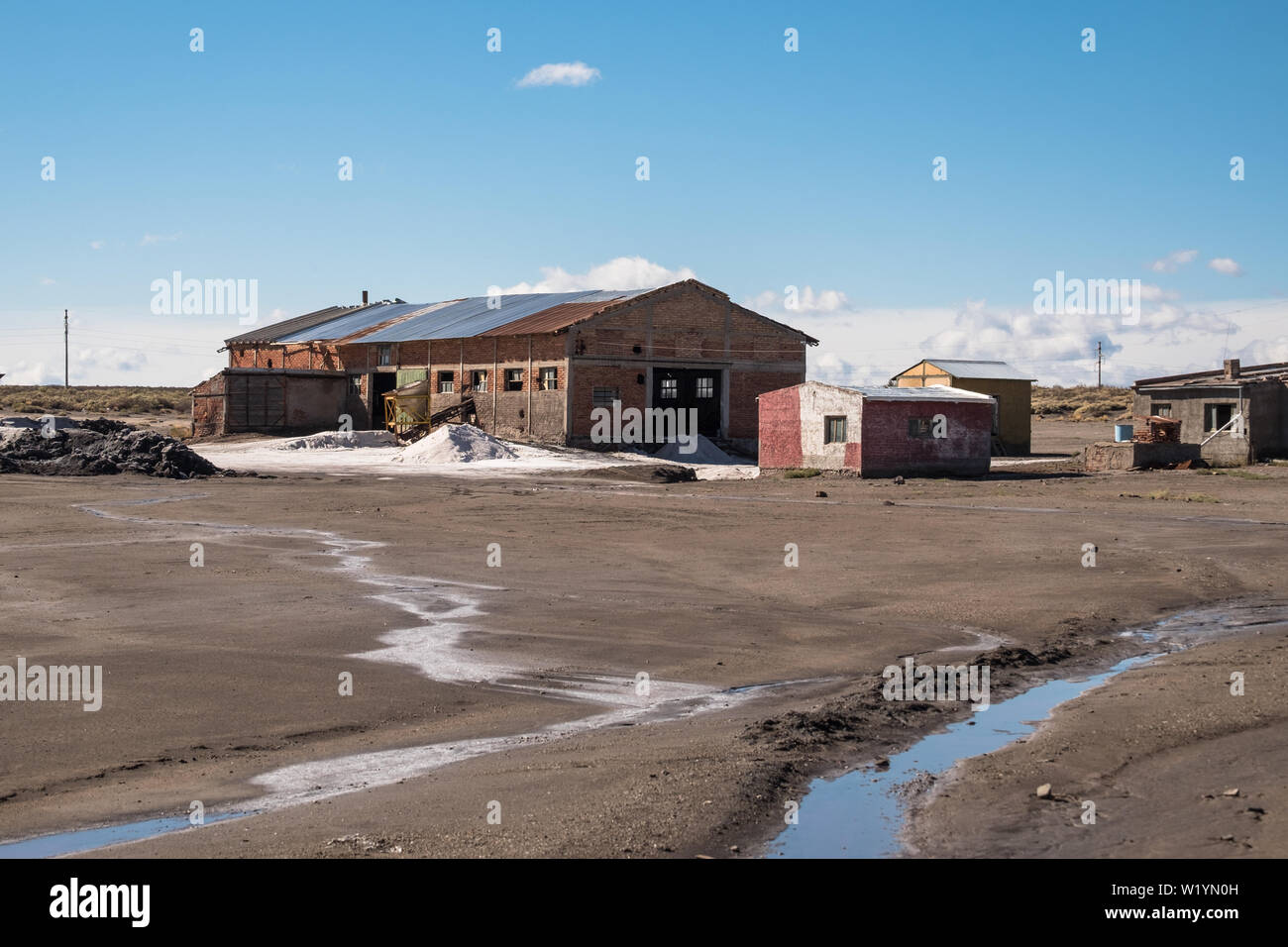 An old factory hall for salt extraction lies in the 'Salinas del Diamante'. The building is in a bad state, but the extraction goes on. Stock Photo