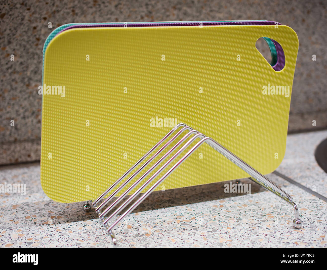 Set of multicolored cutting boards on a metal stand Stock Photo Alamy