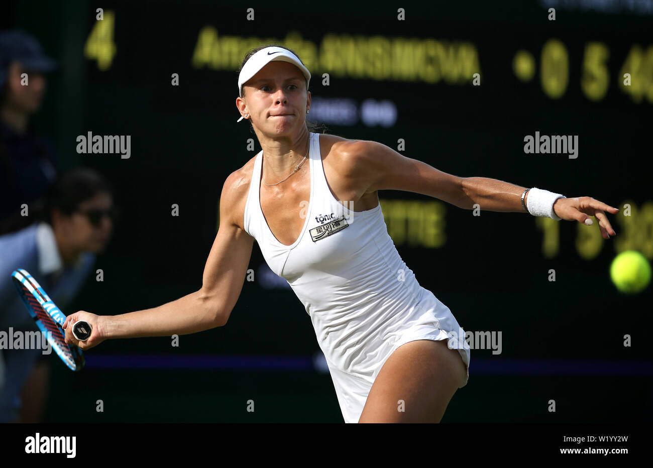Magda Linette during her second round match against Amanda Anisimova on day  four of the Wimbledon Championships at the All England Lawn tennis and  Croquet Club, London Stock Photo - Alamy