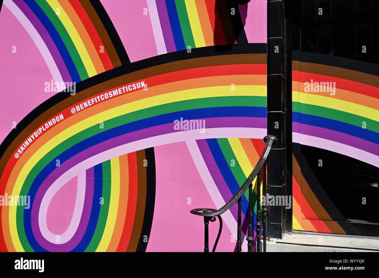 Shops and businesses display rainbow colours prior to the Pride in London Celebrations this weekend. London. UK Stock Photo