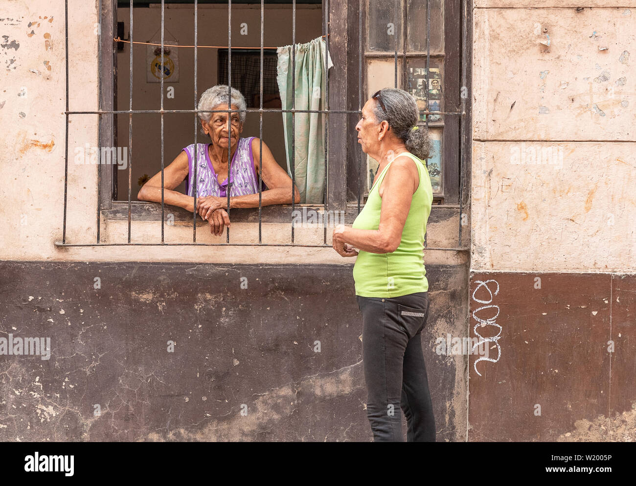 Havana, Cuba - April 09, 2019:  two women visit on the street Stock Photo