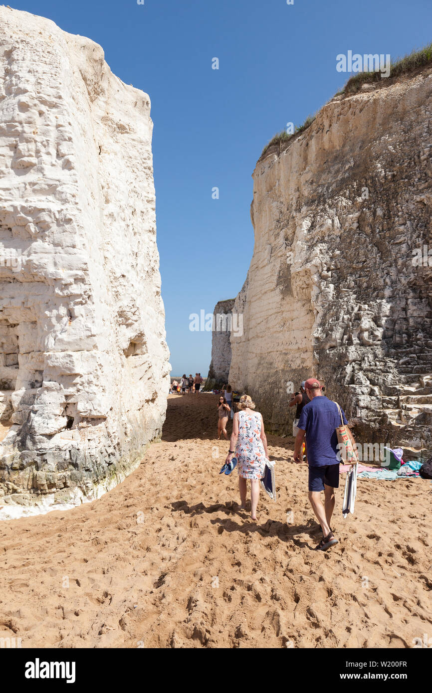 A couple walking through the chalk stacks at Botany Bay in Kent, England. Stock Photo