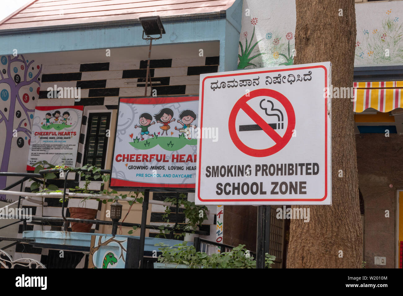 Bengaluru, India June 27, 2019: Smoking Prohibited School zone bill board in front of the School Building Stock Photo
