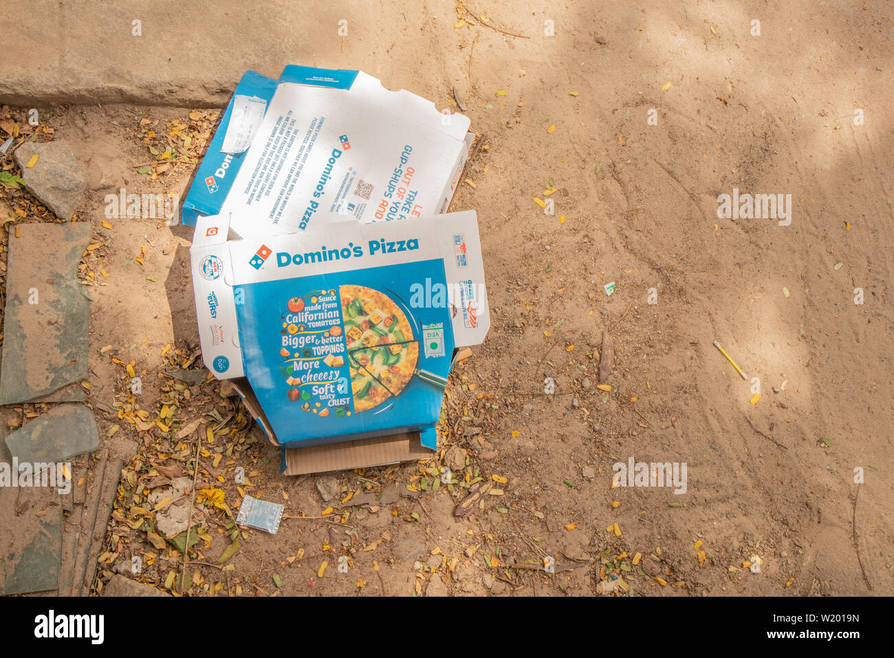 Bengaluru, India June 17, 2019 : Domino's Pizza Box thrown away on the road side. Stock Photo
