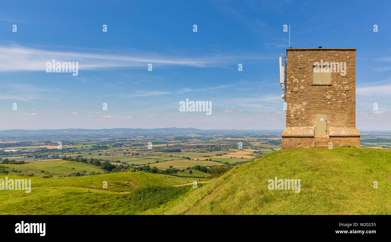 Parson's Folly on top of the earthworks at Kemerton Camp Iron Age fort on Bredon hill with the Malvern hills in the background, Worcestershire Stock Photo