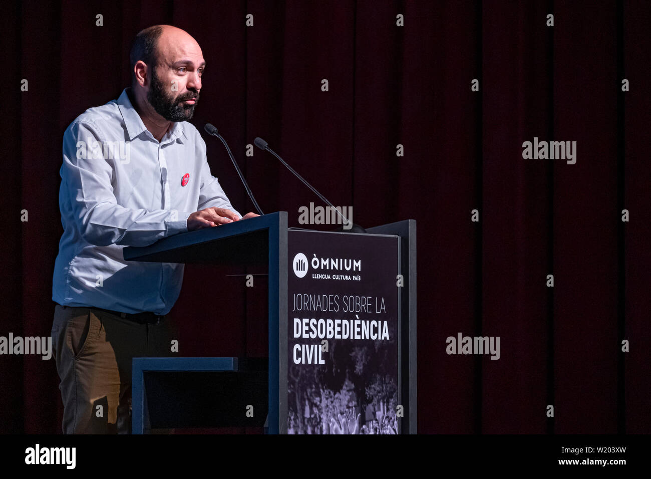 Marcel Mauri, vice-president of Òmnium, speaks during the event.Organized by the Catalan independents’ entity Òmnium Cultural, the first day on Civil Disobedience took place in the Born Cultural Center. These two days, 4 and 5 July, of conferences and round tables aim to establish the theoretical basis for civil disobedience as a way to solve the problem of the independence of Catalonia after the repeated refusal of the Spanish state to hold a Referendum. Stock Photo