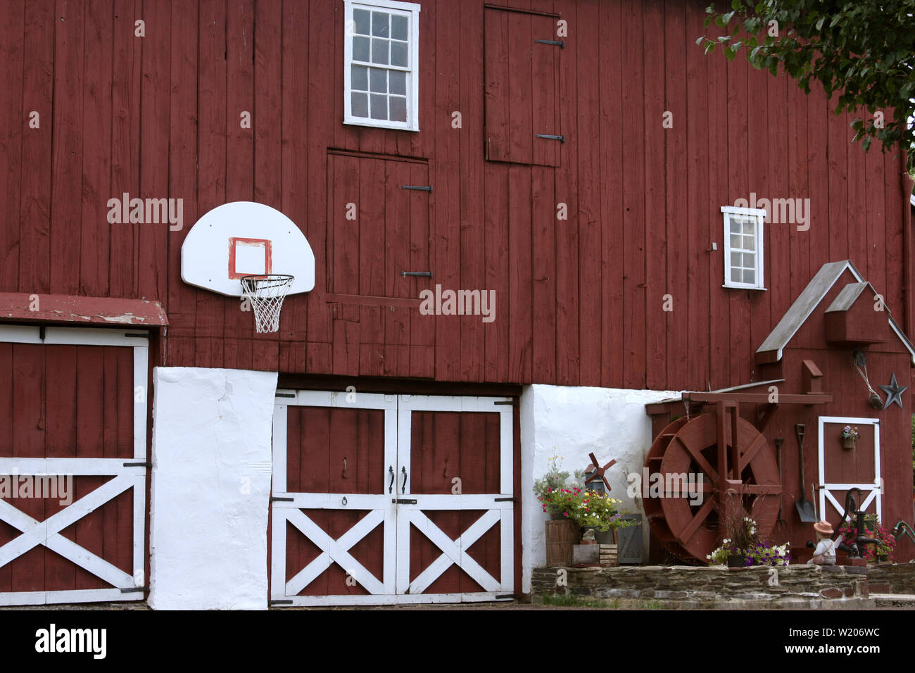 Large Old Wooden Barn With Water Mill Decoration In Rural