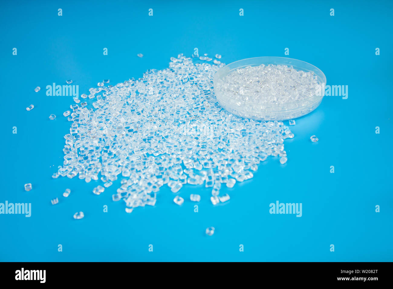 Transparent Polypropylene, polypropene, polystyrene, polyethylene, thermoplastic polymer, HDPE and plastic raw material pellets or granules. Stock Photo