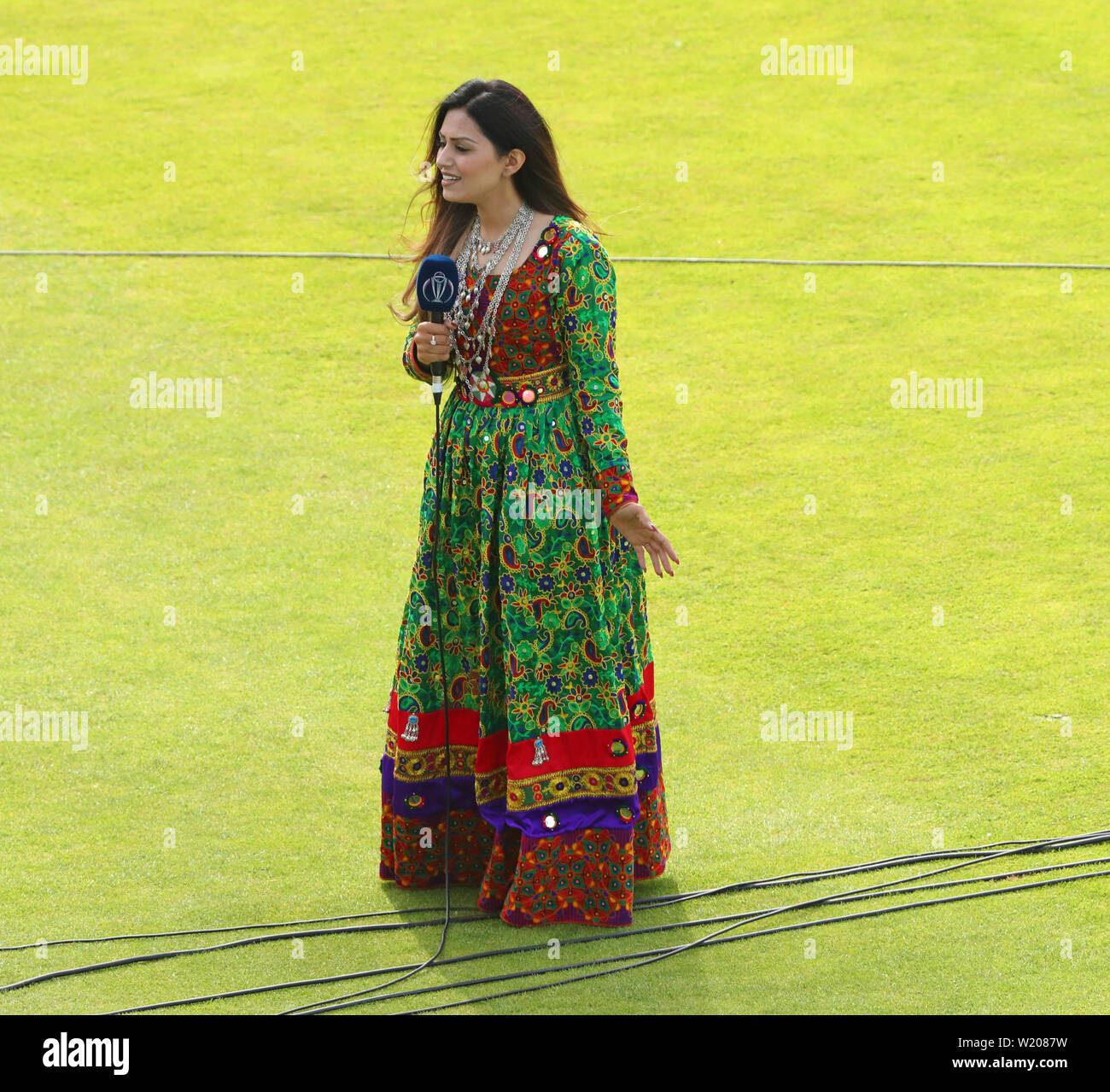 Leeds, UK. 04th July, 2019. An Afghanistan reporter dressed in traditional Afghan dress during the Afghanistan v West Indies, ICC Cricket World Cup match, at Headingley, Leeds, England. Credit: csm/Alamy Live News Stock Photo