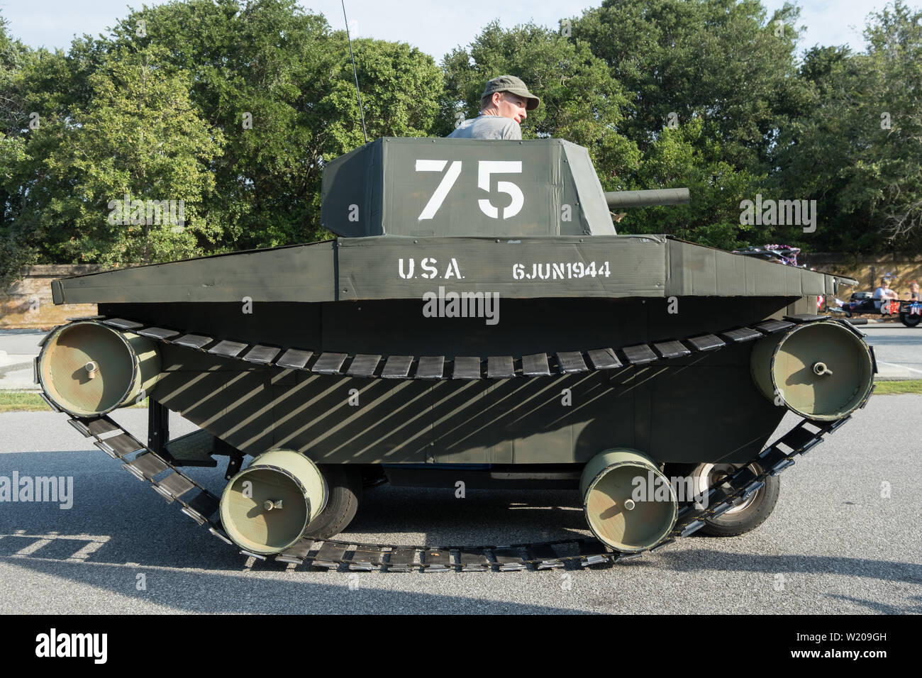 Sullivans Island South Carolina, USA. 4th July, 2019. A golf cart decorated as a military tank takes part in the annual Independence Day parade July 4, 2019 in Sullivan's Island, South Carolina. The tank was a tongue-in-check reference to the controversy over the military parade in Washington. Credit: Planetpix/Alamy Live News Stock Photo
