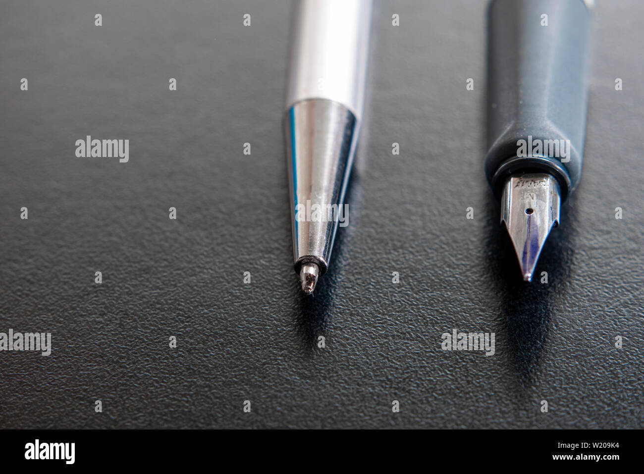 Fountain pen and a ballpoint pen. Illustration to represent the situation of the office and desk work. Stock Photo