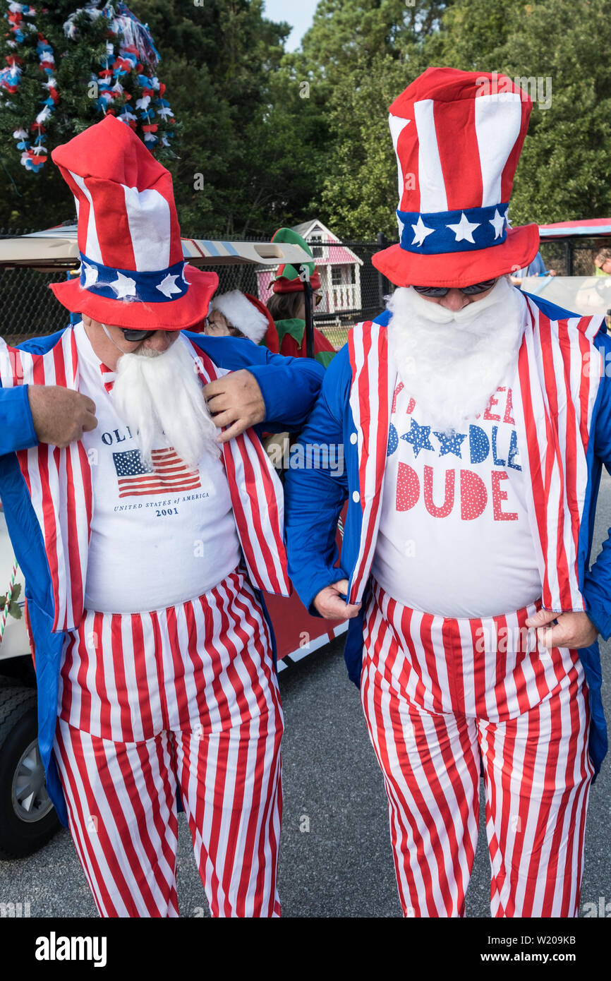 Sullivans Island South Carolina, USA. 4th July, 2019. Men dressed in Uncle Sam costumes get ready for the annual Independence Day parade July 4, 2019 in Sullivan's Island, South Carolina. The tiny affluent Sea Island beach community across from Charleston holds an outsized golf cart parade featuring more than 75 decorated carts. Credit: Planetpix/Alamy Live News Stock Photo