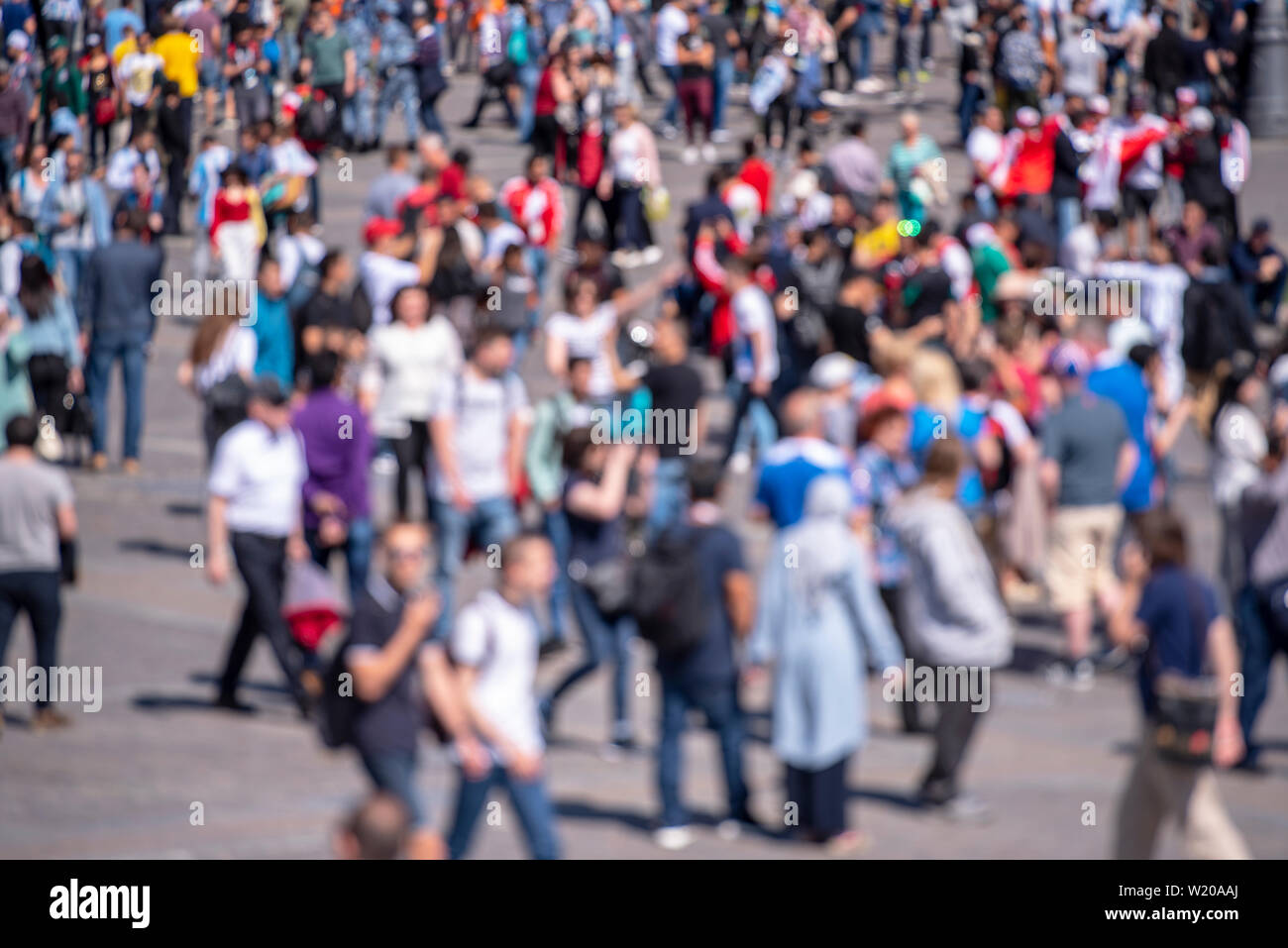 Blurred Picture of crowd People as Background, out of focus Picture of Crowd of People in Summer Day Stock Photo