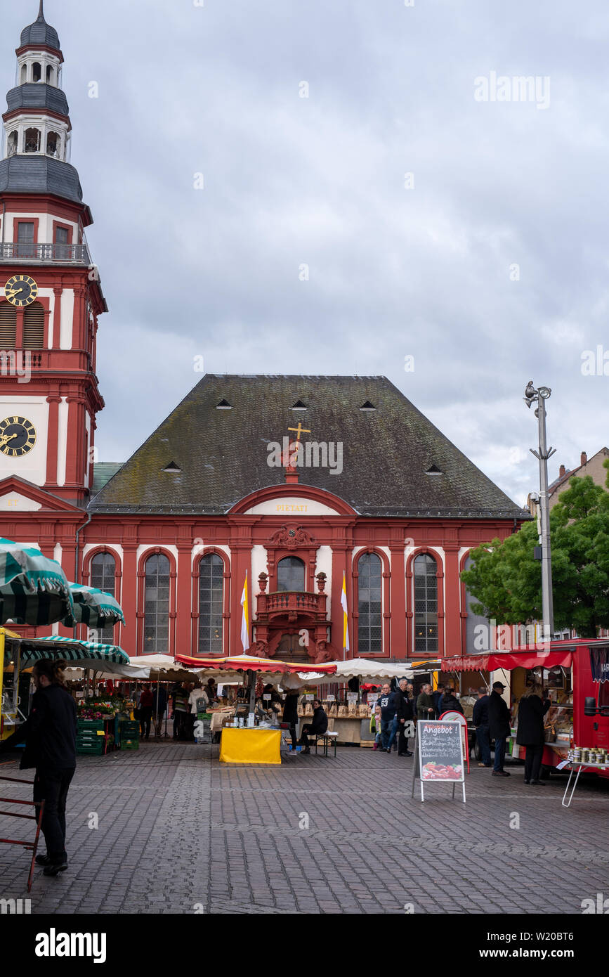 MANNHEIM, GERMANY, 05/11/2019: market square with stands in front of the town hall on a rainy day Stock Photo