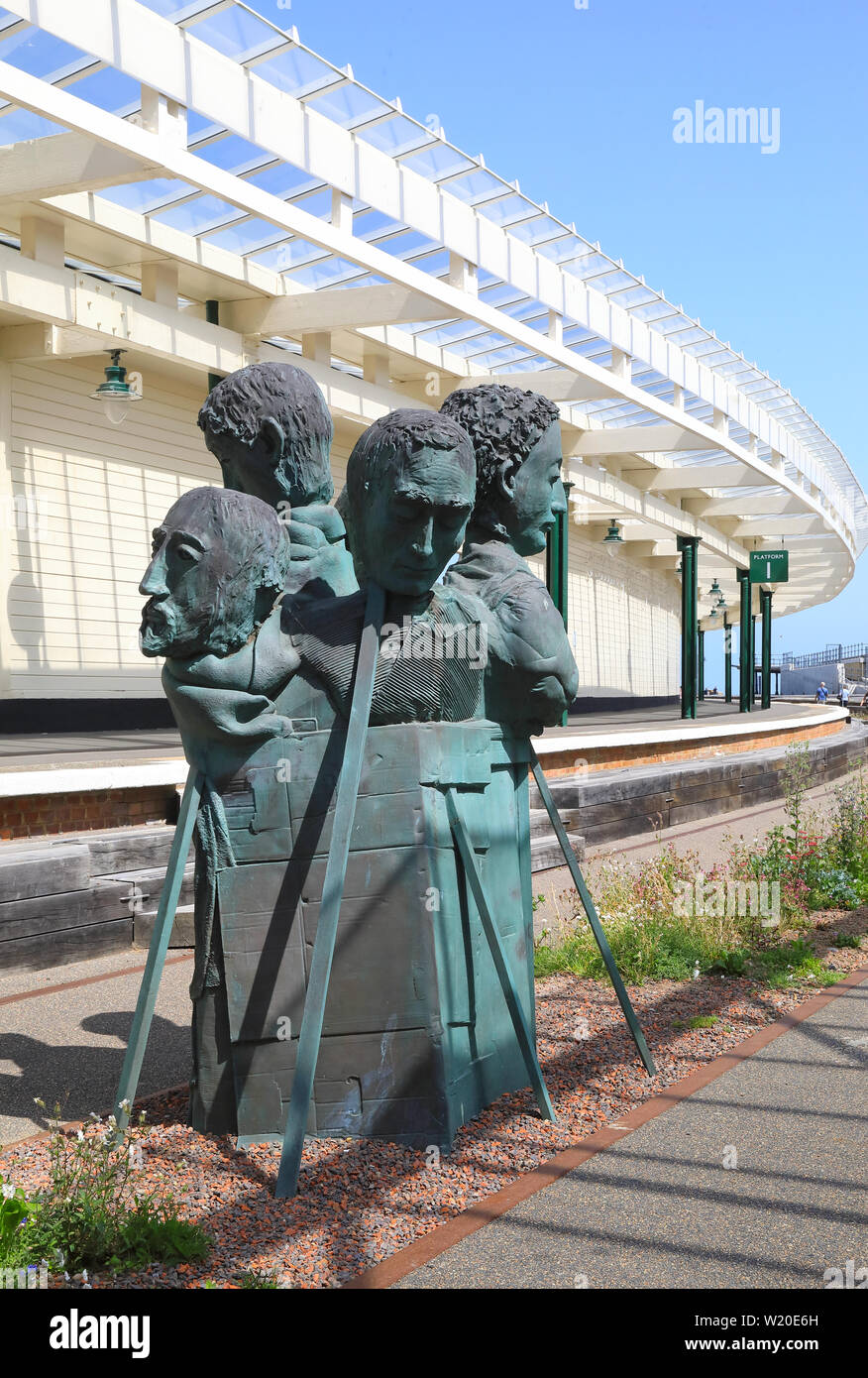 The sculpture 'Rug People' at Folkestone harbour train station restored as part of the Harbour Arm, in Kent, SE England, UK Stock Photo