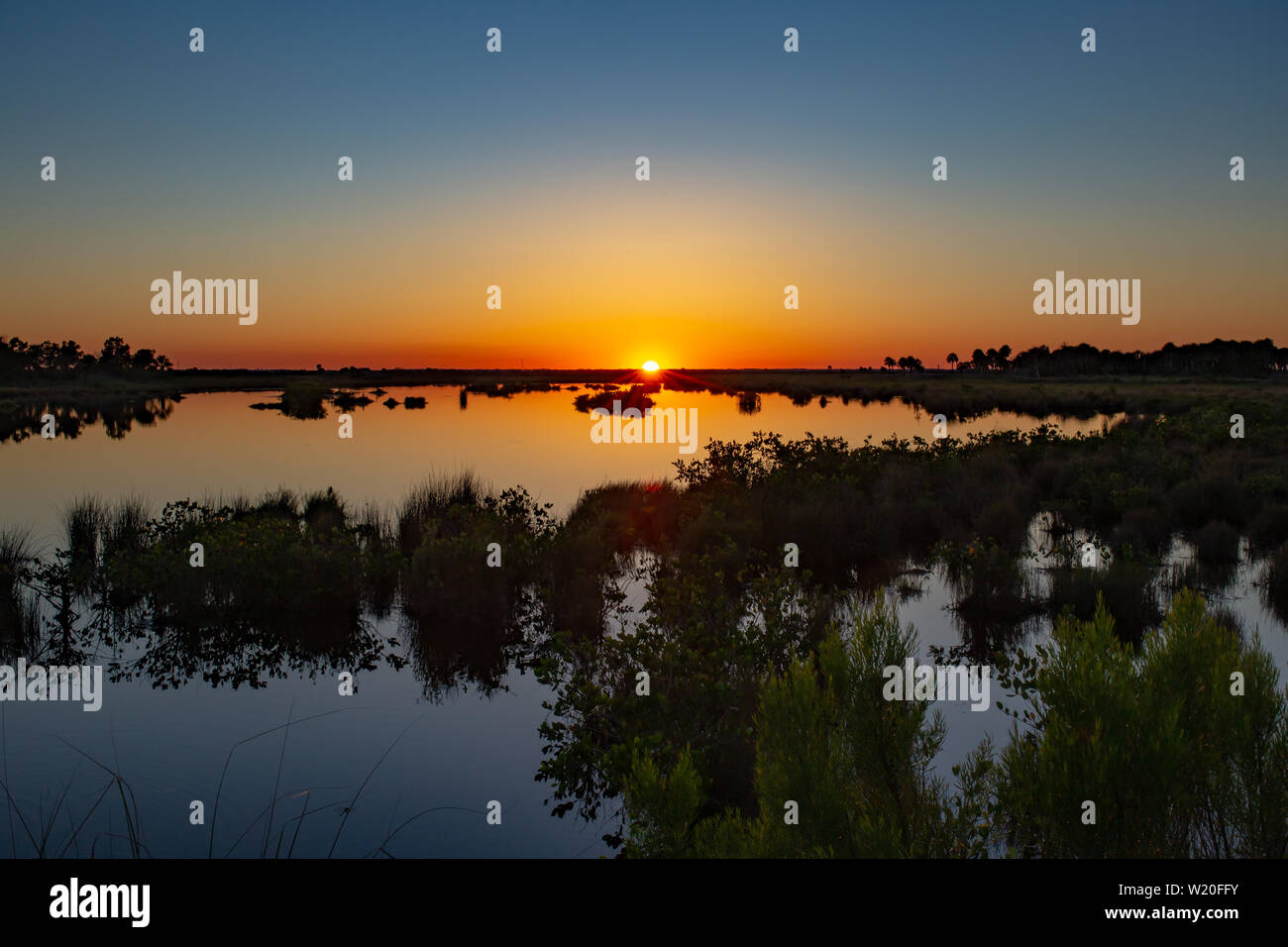 Stunning Spring sunset over marshland and mudflats of the Florida Everglades. Stock Photo