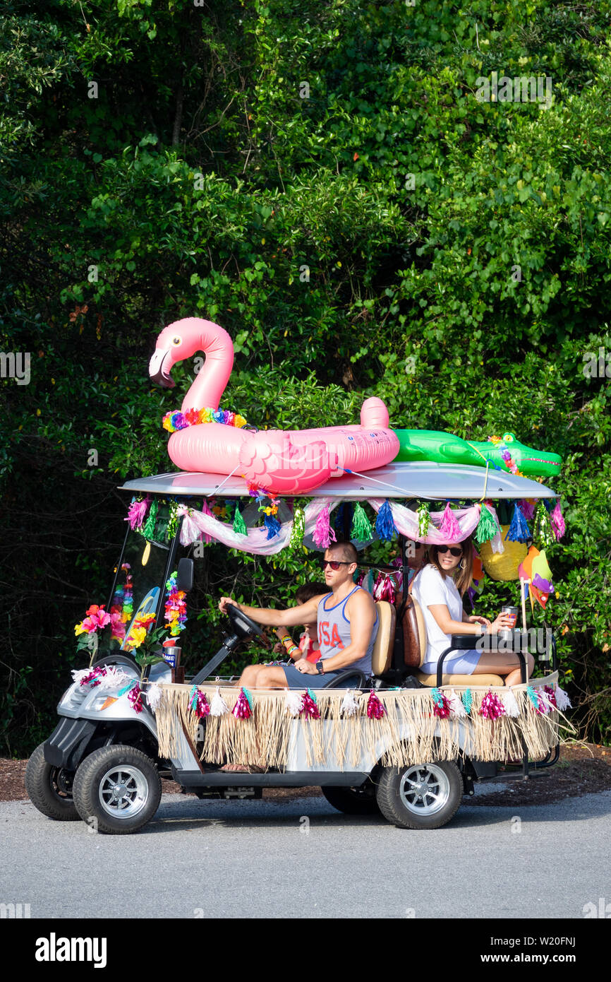 A golf cart float decorated in beach themes during the annual Independence  Day golf cart and bicycle parade July 4, 2019 in Sullivan's Island, South  Carolina. The tiny affluent Sea Island beach