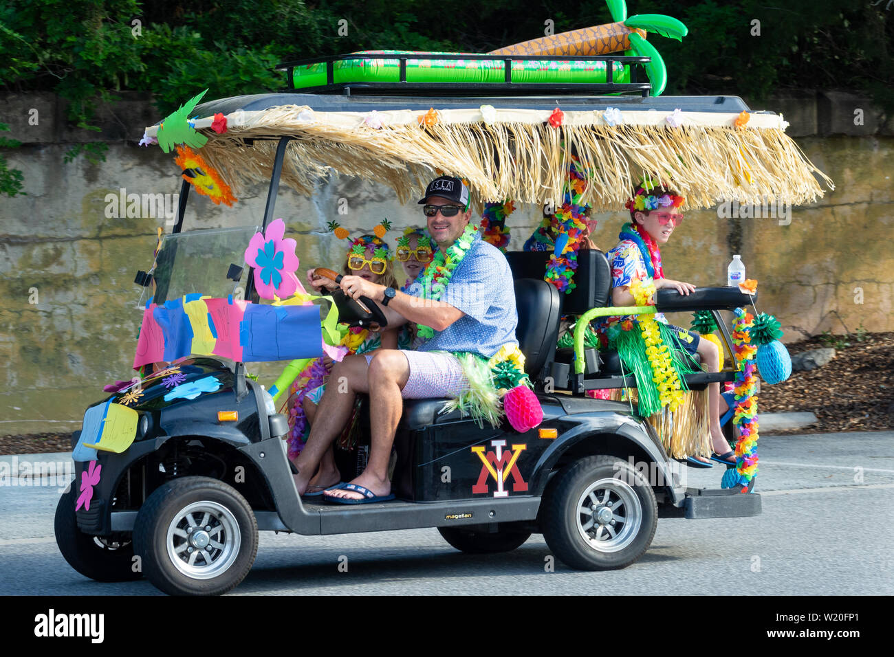 A golf cart float decorated in beach themes during the annual Independence Day golf cart and bicycle parade July 4, 2019 in Sullivan's Island, South Carolina. The tiny affluent Sea Island beach community across from Charleston holds an outsized golf cart parade featuring more than 75 decorated carts. Stock Photo
