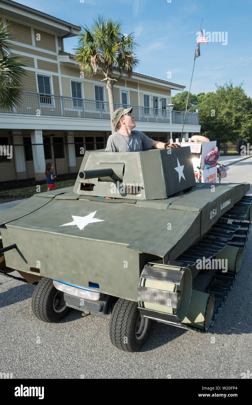 A golf cart decorated as a military tank takes part in the  annual Independence Day parade July 4, 2019 in Sullivan's Island, South Carolina. The tank was a tongue-in-check reference to the controversy over the military parade in Washington. Stock Photo