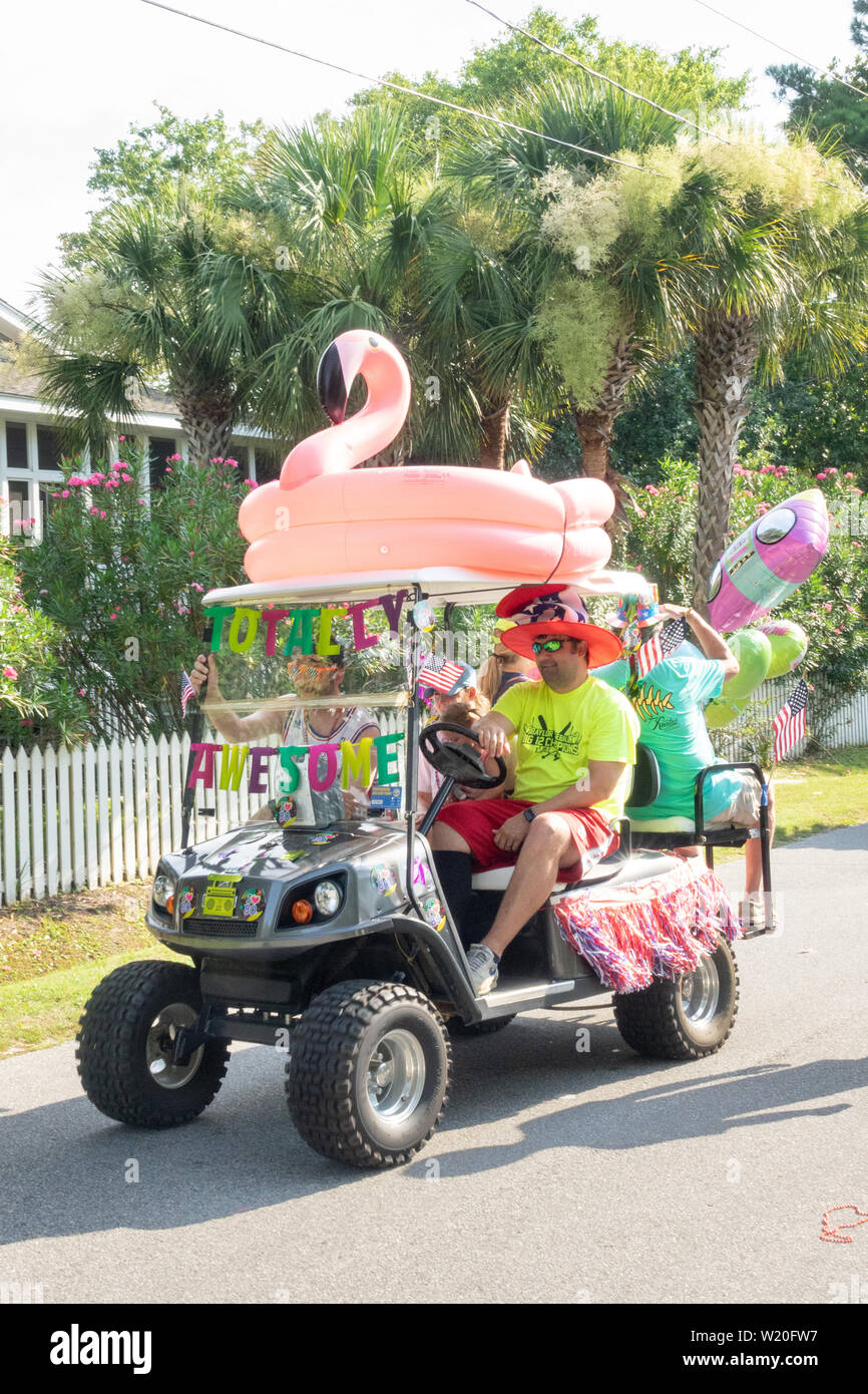 Golf cart floats decorated in tropical style during the annual Independence Day parade July 4, 2019 in Sullivan's Island, South Carolina. The tiny affluent Sea Island beach community across from Charleston holds an outsized golf cart parade featuring more than 75 decorated carts. Stock Photo