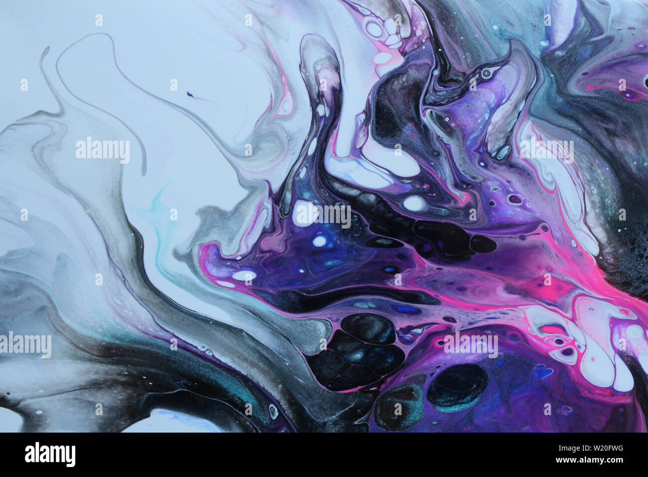 Background of abstract acrylic pour painting that has been