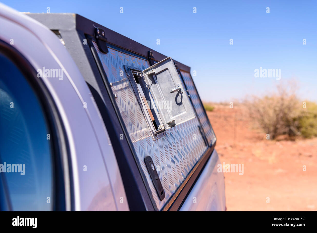 Flap on the side of a pick-up truck canopy, which should be opened when driving on dusty roads to prevent dust being sucked inside. Stock Photo