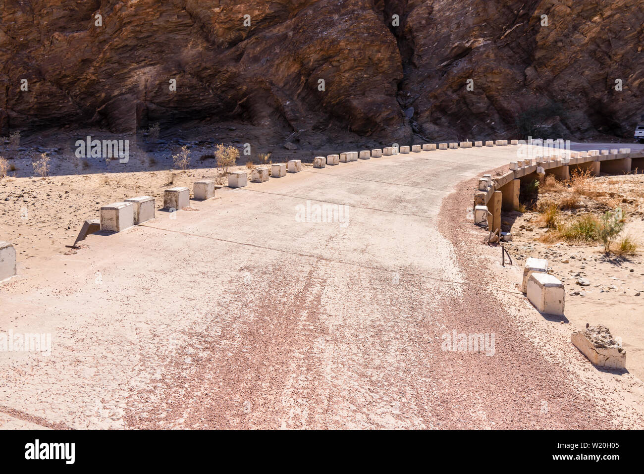 Concrete bridge over a dried up riverbed in Namibia. Stock Photo