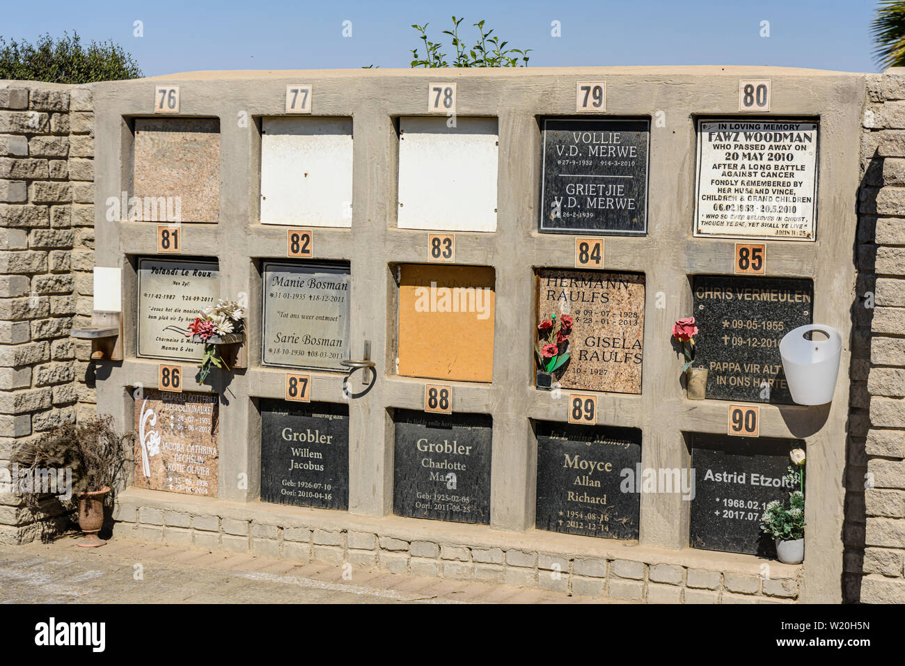 Numbered holes for the internment of ashes in a German graveyard, Namibia Stock Photo