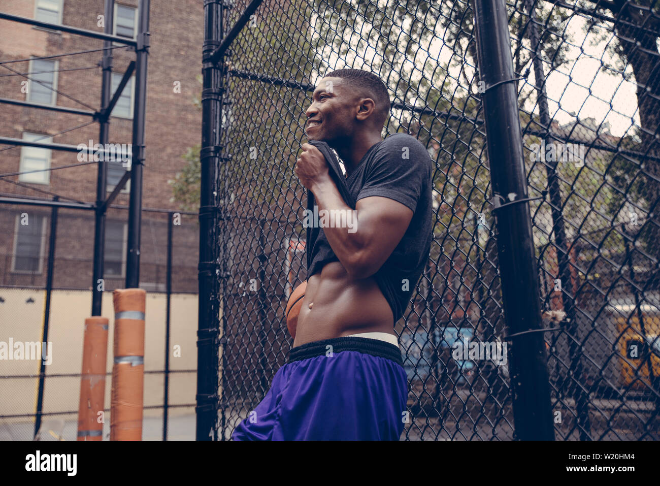 Basketball player training on a court in New york city Stock Photo