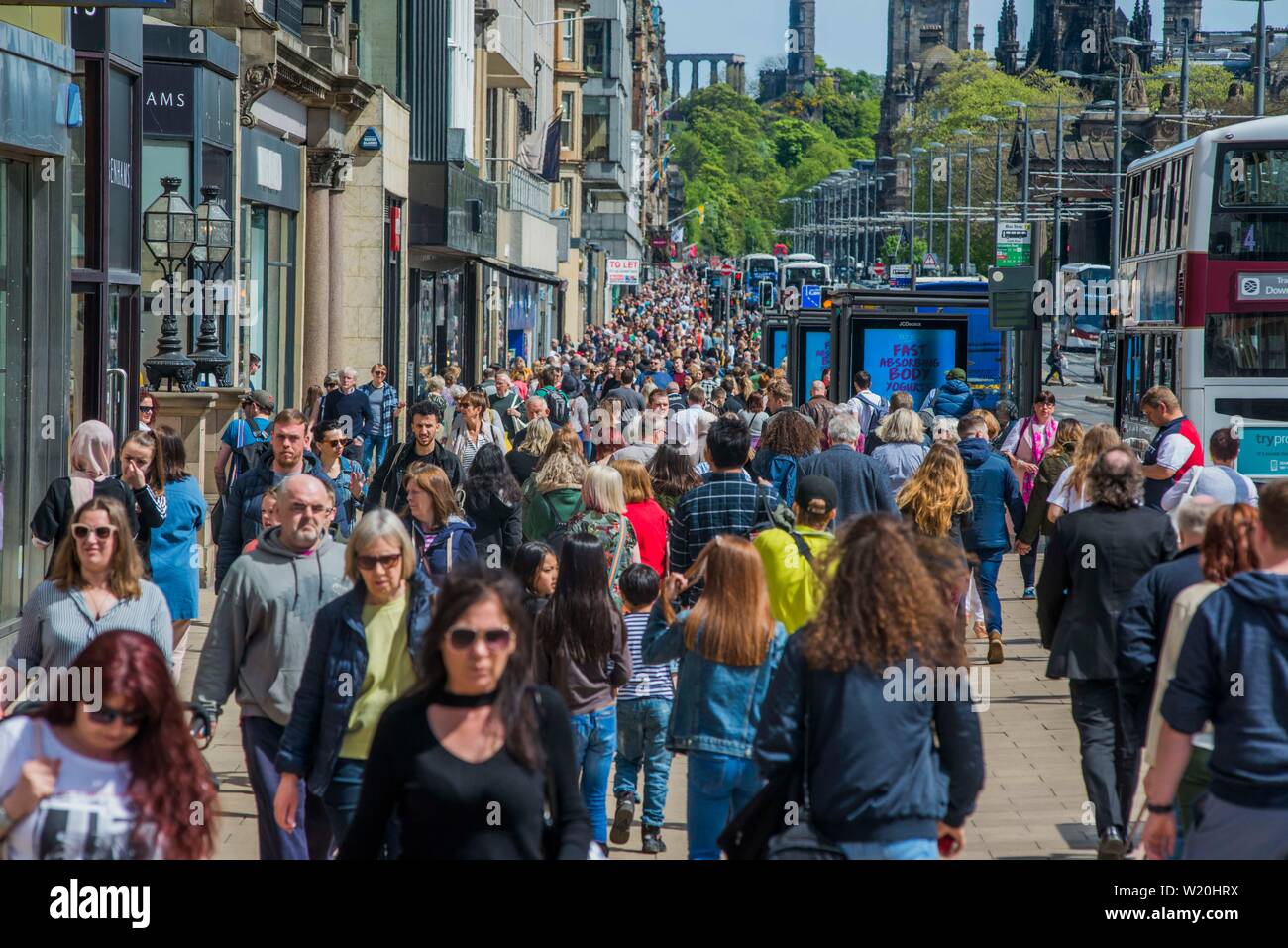 Princes Street, Edinburgh, Scotland UK filled with shoppers on a summer's day. Stock Photo