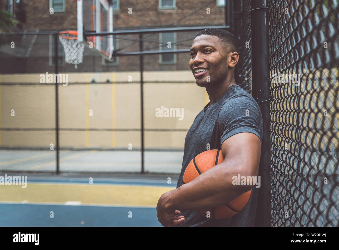 Basketball player training on a court in New york city Stock Photo