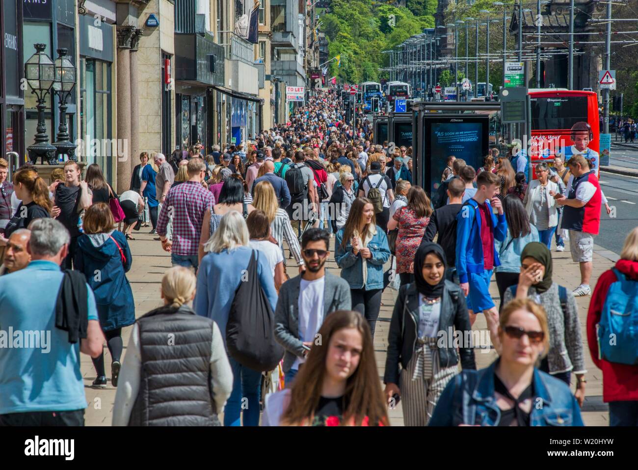 Princes Street, Edinburgh, Scotland UK filled with shoppers on a summer's day. Stock Photo